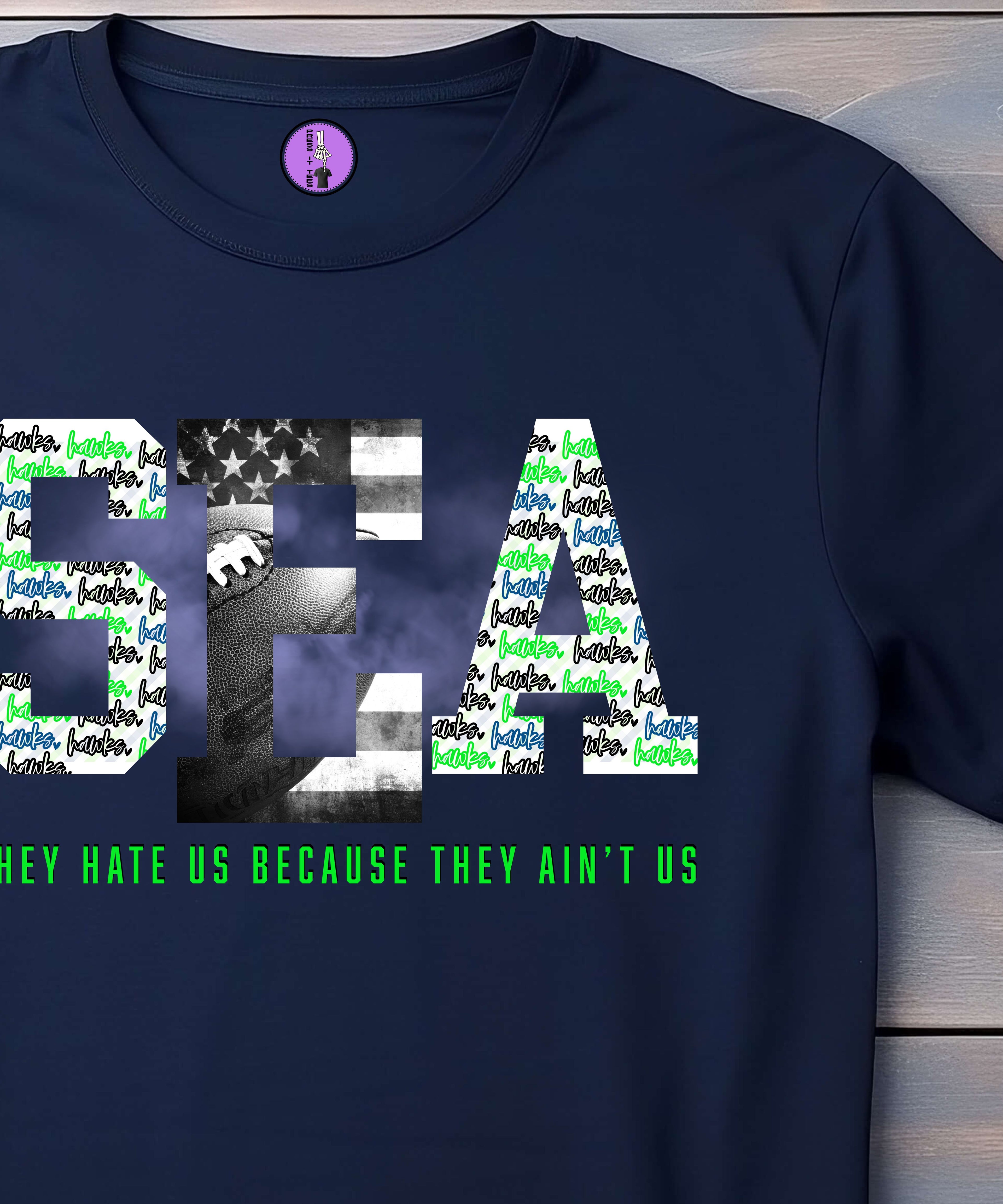 Press It Tees Seattle Football Hate Us Aint Us unisex short sleeve T-shirt, casual clothing with bold printed design.
