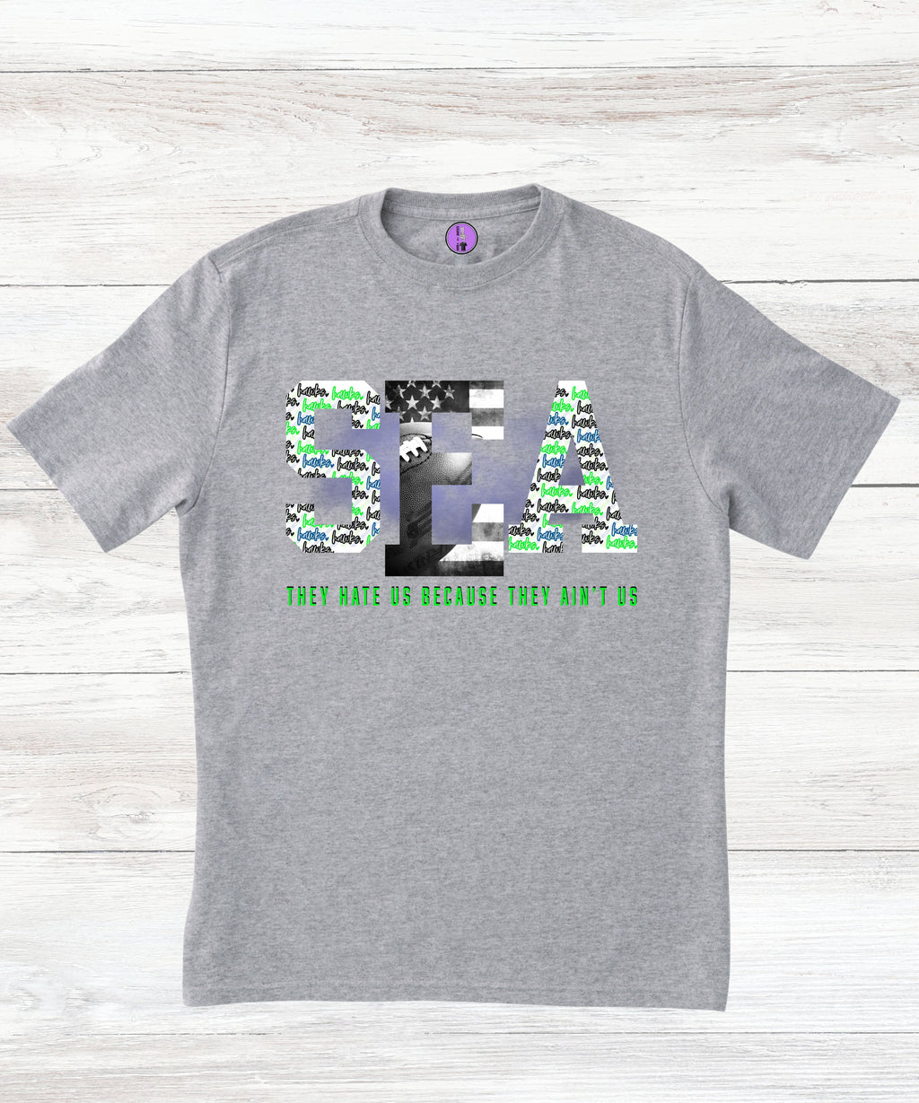 Press It Tees Seattle Football Hate Us Aint Us unisex short sleeve T-shirt, white casual clothing with bold printed design.